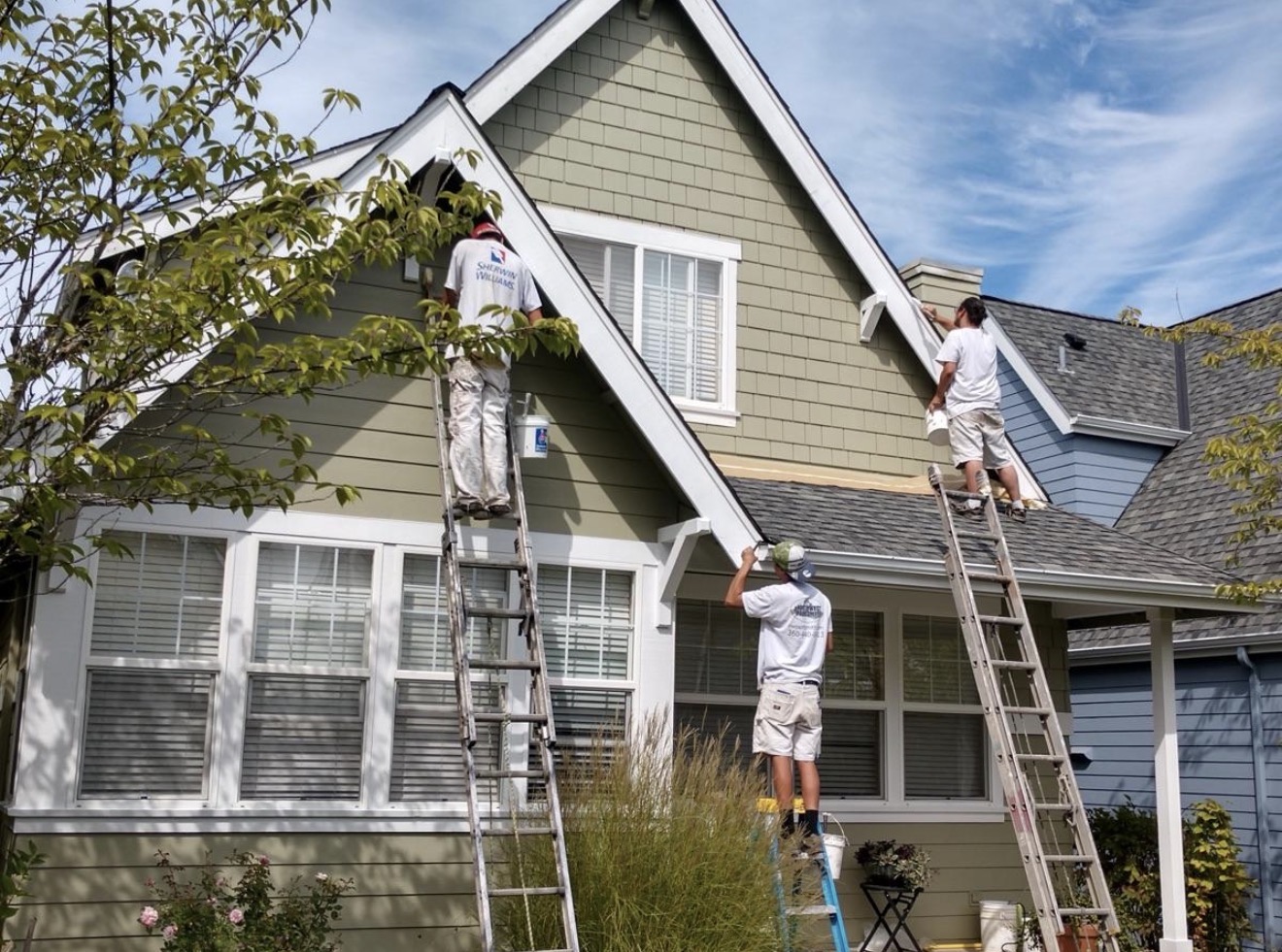 Exterior painting crew working on home